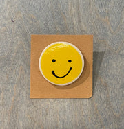 Smiley face ceramic pins