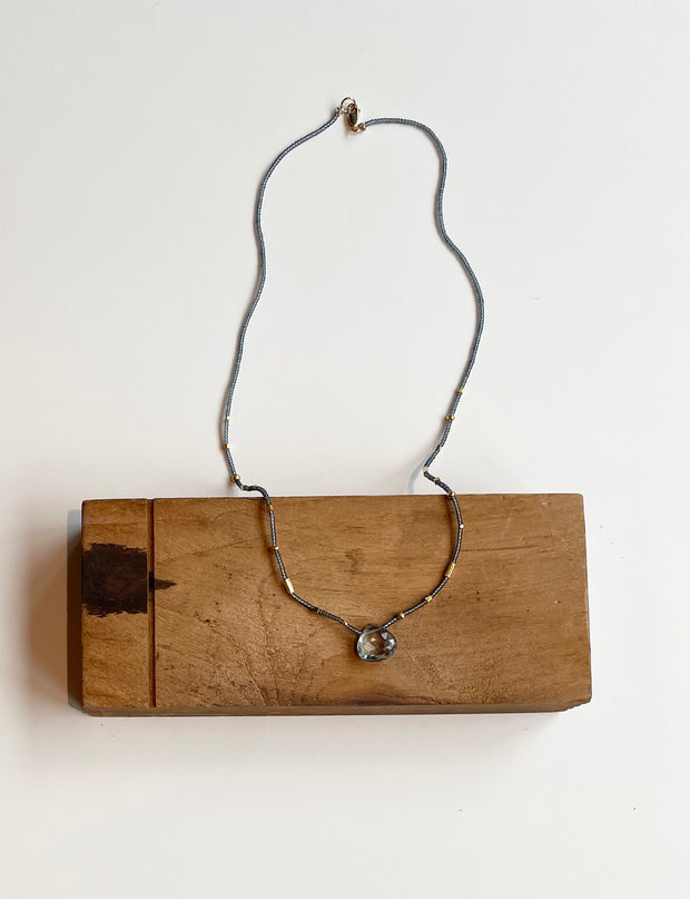 Grey seed with gold vermeil and quartz drop necklace